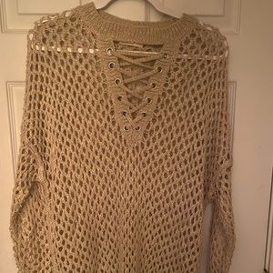 Women’s gold sweater